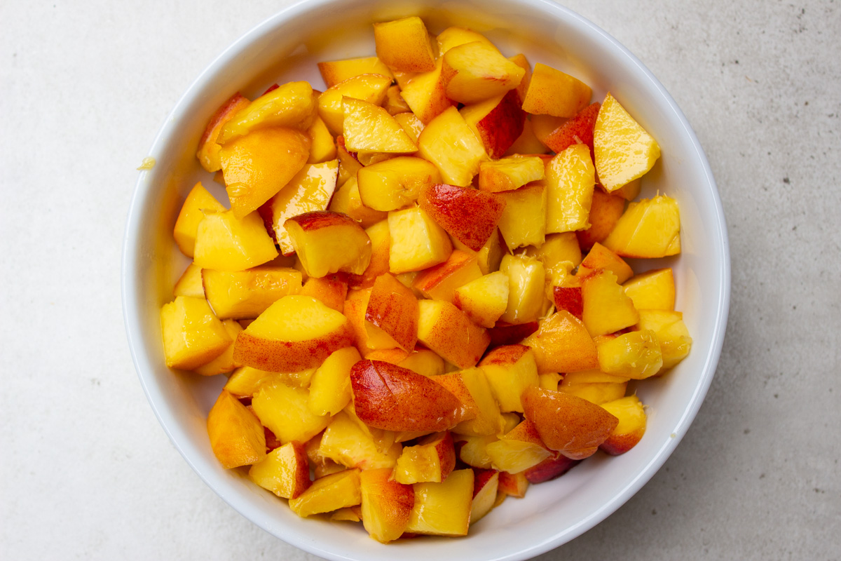 fresh diced peaches in bowl.