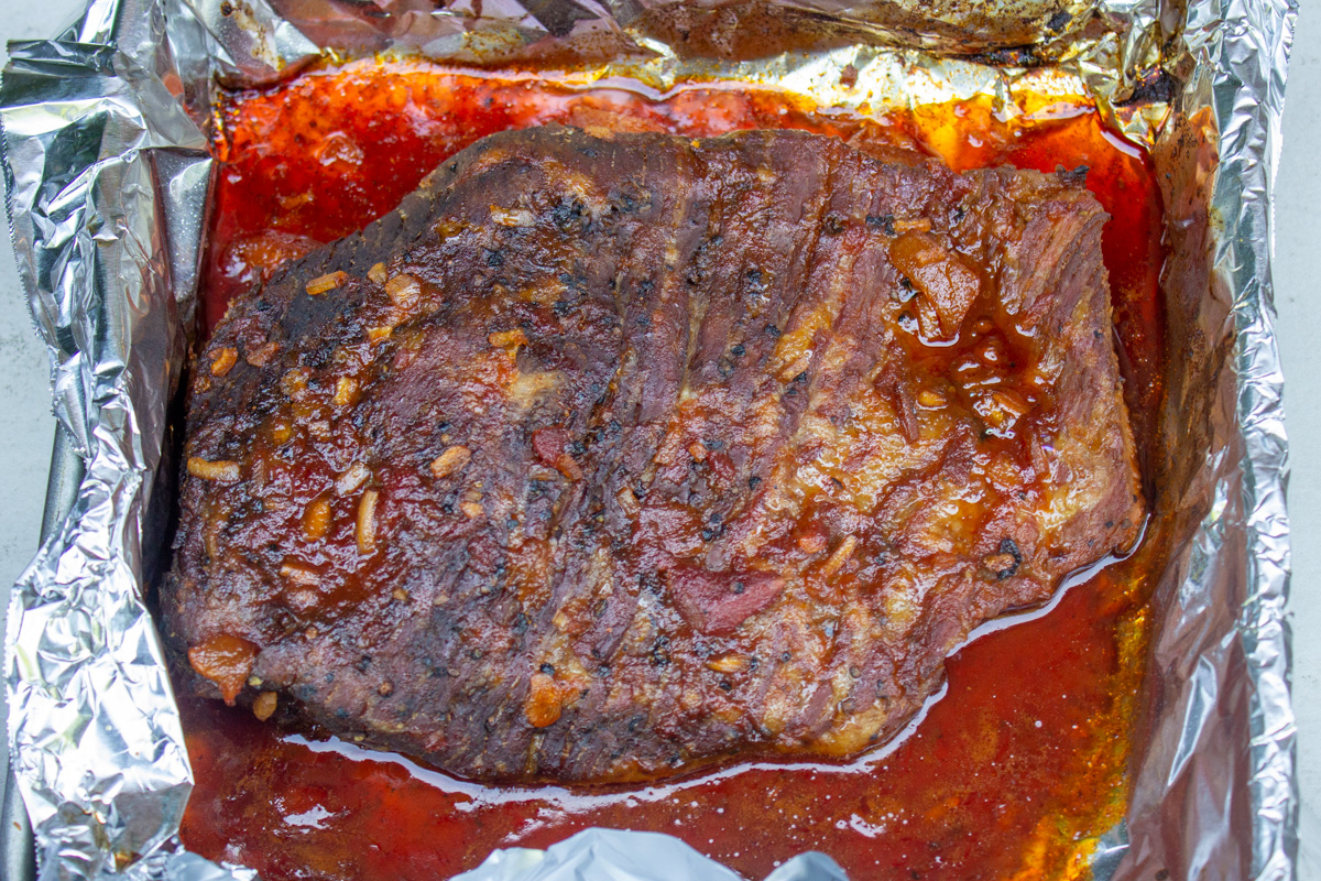 brisket with sauce after oven baking.