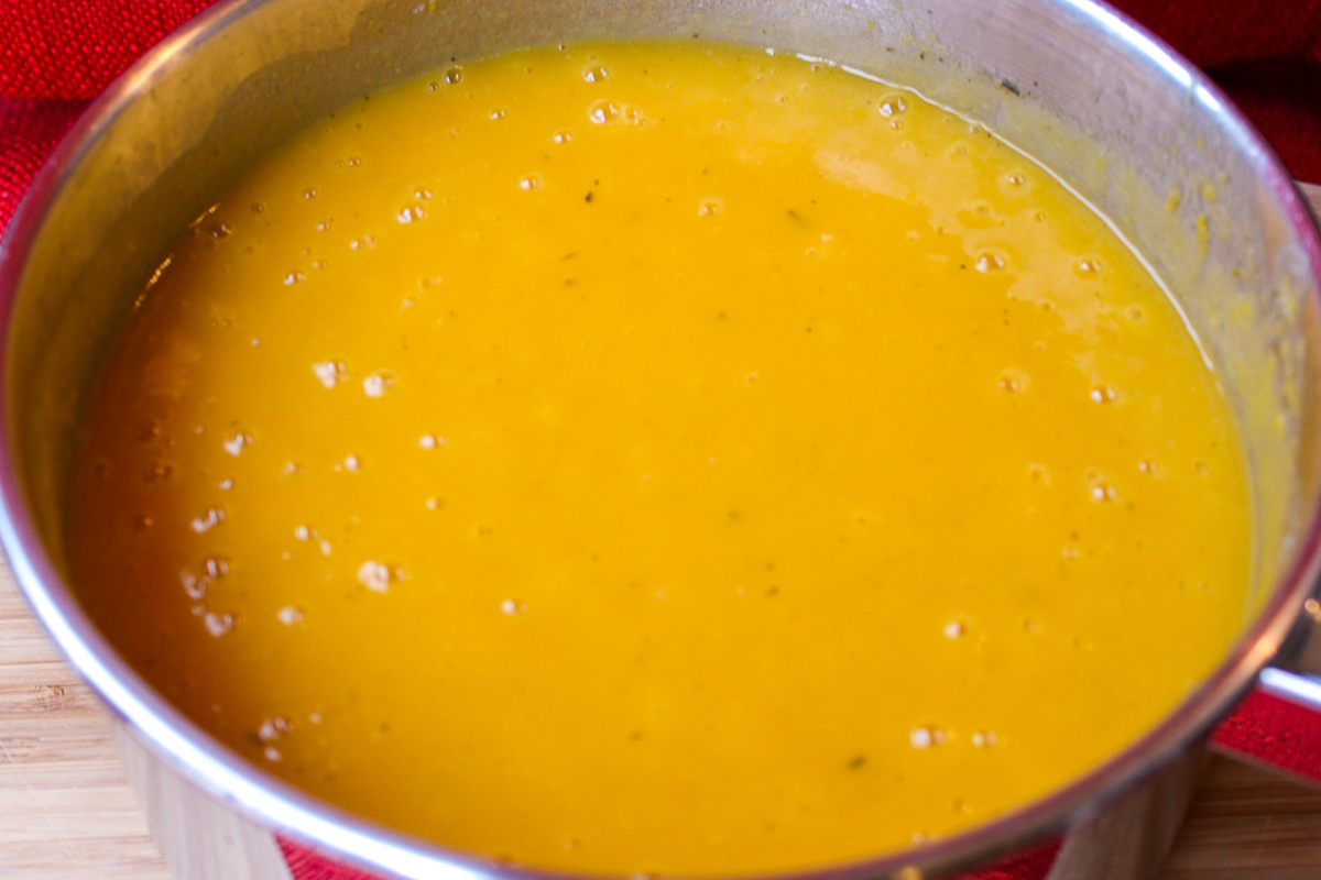 Thai butternut squash soup pureed in pot.