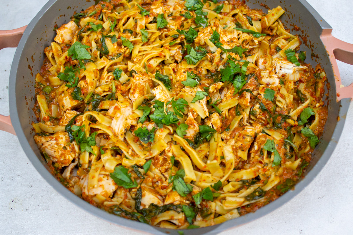 spicy chicken pasta in skillet.