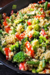 veggie fried rice with peanut sauce in skillet.
