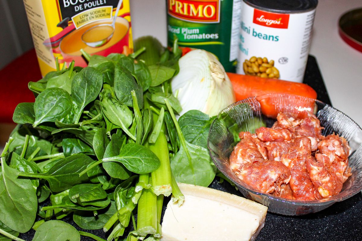 canellini beans, can of tomatoes, broth, sausage meat, onion, parmesan, spinach, carrot, celery.