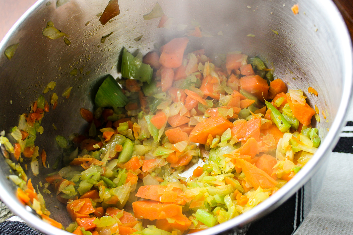 sauteed veggies in pot.
