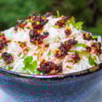 coconut jasmine rice with cilantro and chili crisps in bowl.
