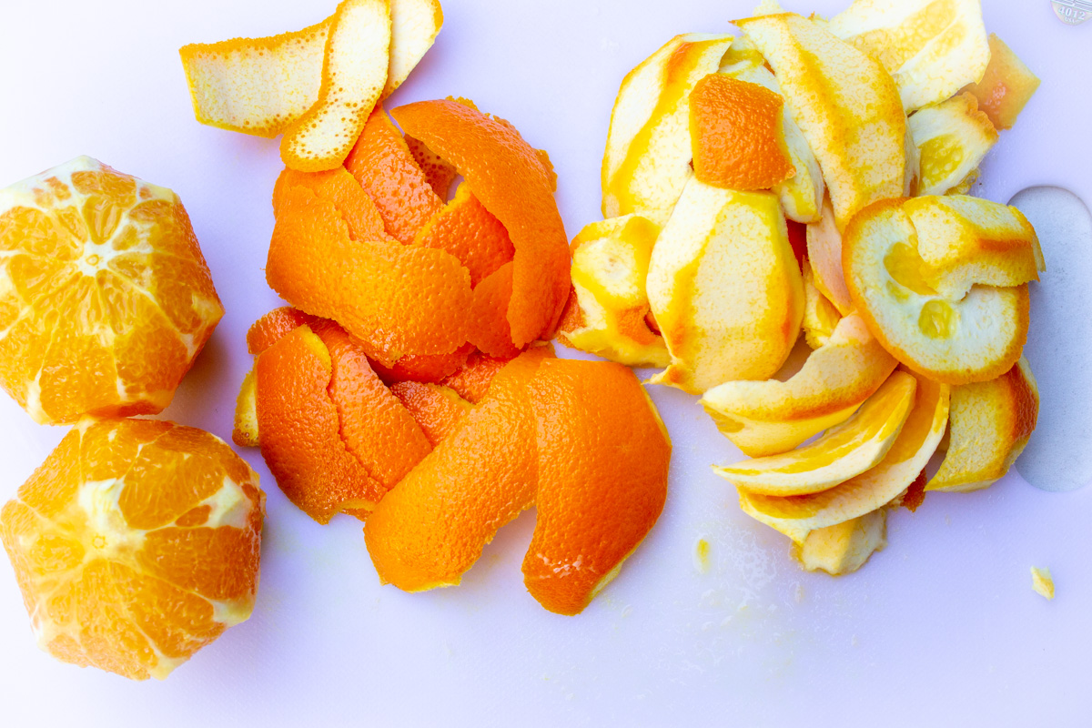 peeled oranges with pitch sliced off.