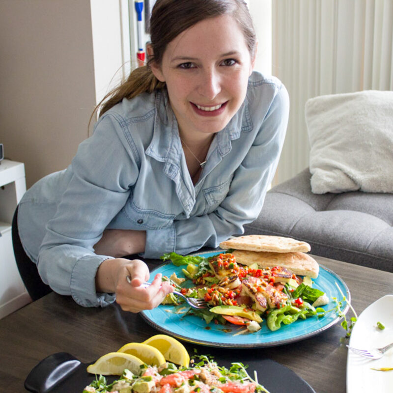 Author Jenna in front of a meal made by her and mom Cheryl .