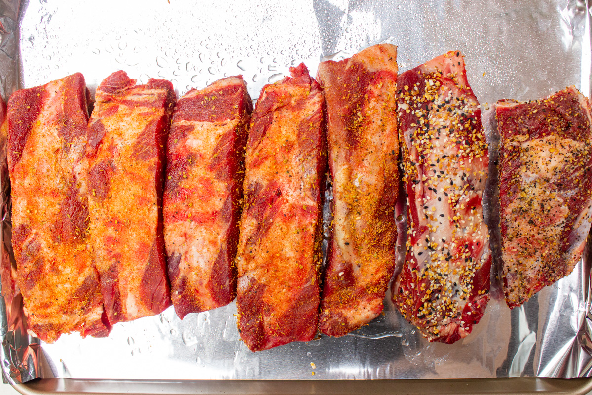 seasoned ribs in single layer on baking sheet.