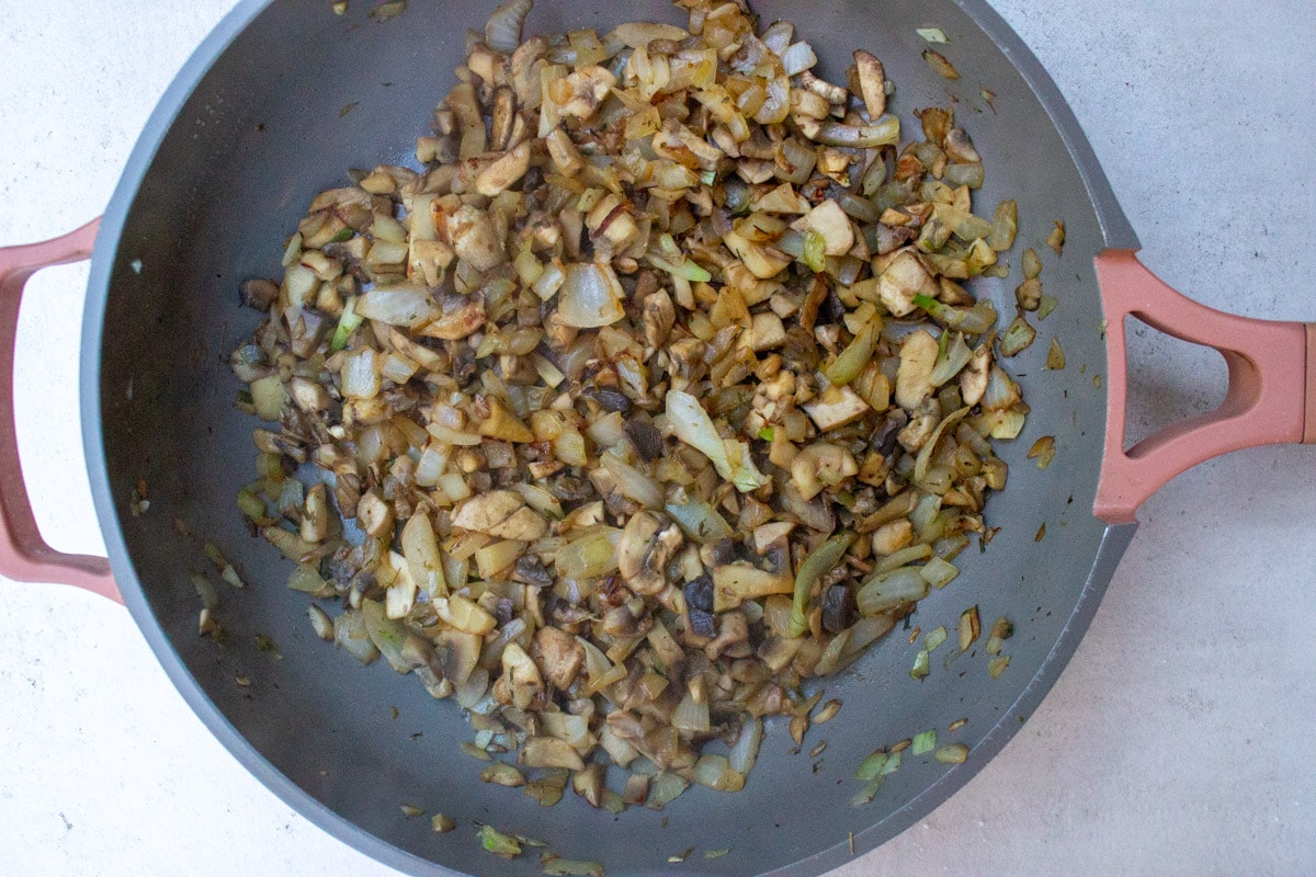 sauteed onions and mushrooms in saucepan.