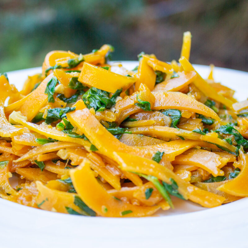 butternut squash noodles with spinach in bowl.