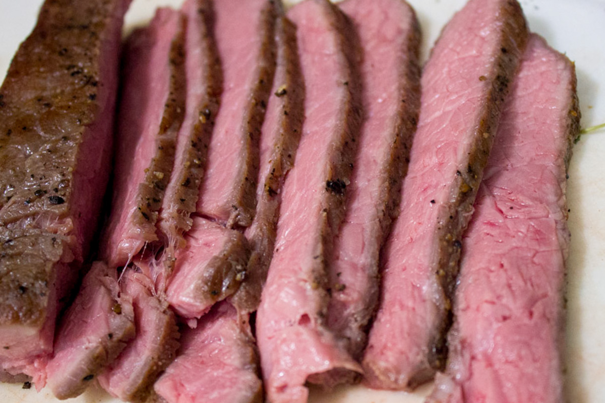sliced sous vide medium rare steak.