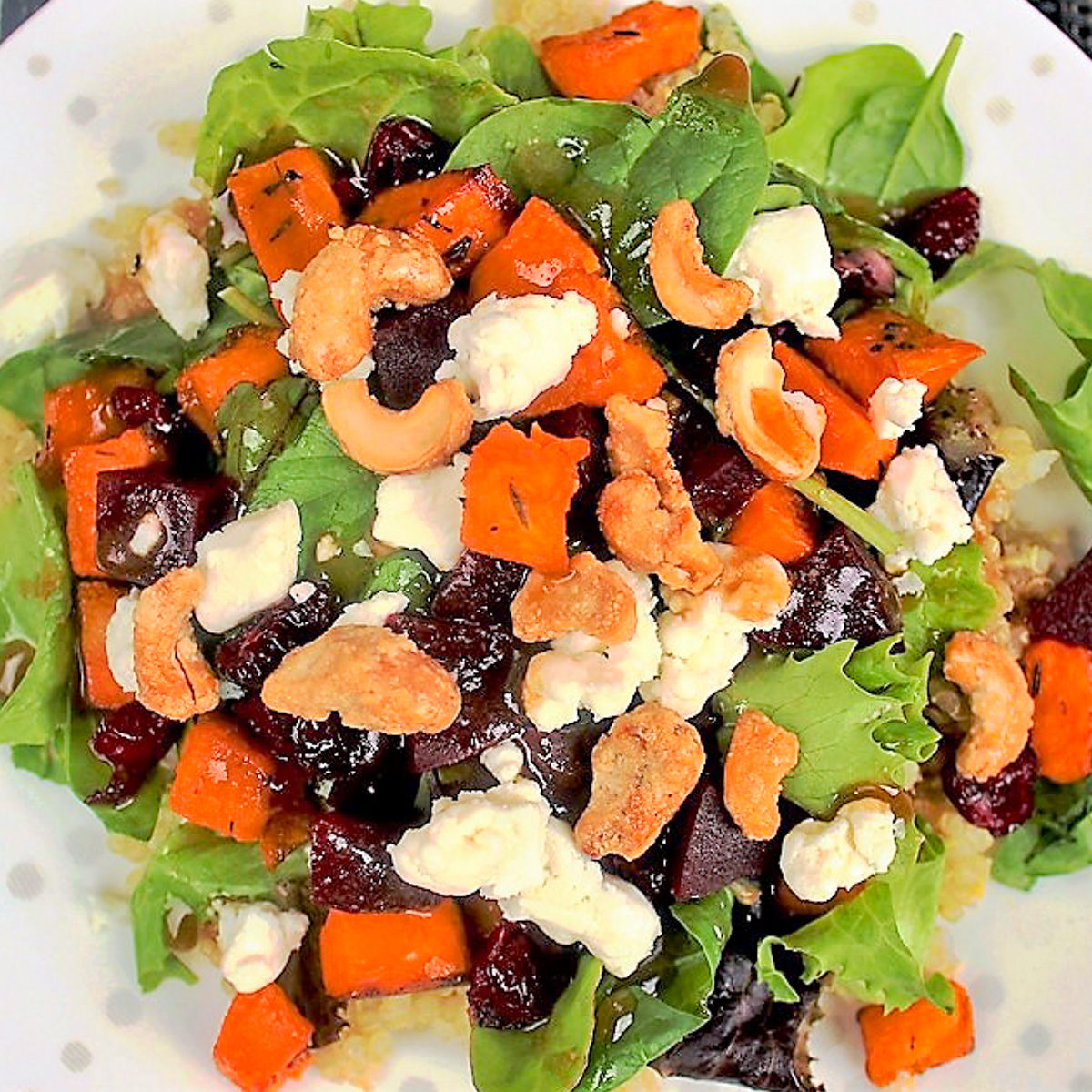 sweet potato and quinoa salad with nuts, cheese, beets.