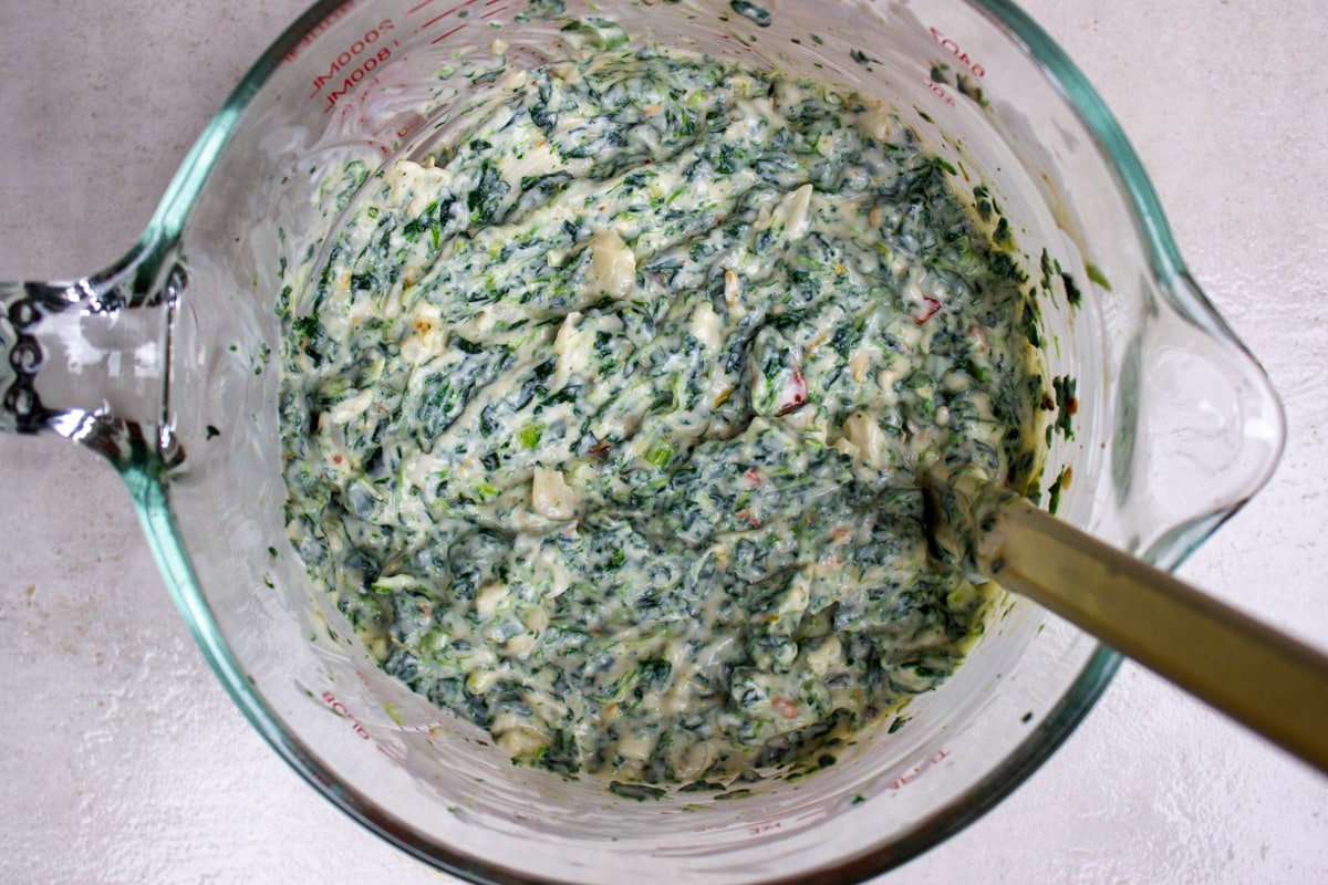 spinach dip mixture in mixing bowl.