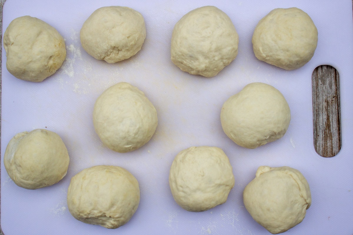 balls of dough on cutting board.