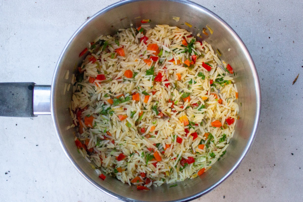 rice and vegetables cooked in pot.