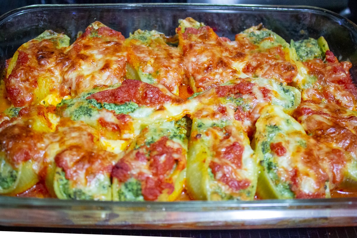 baked stuffed pasta shells in casserole dish.