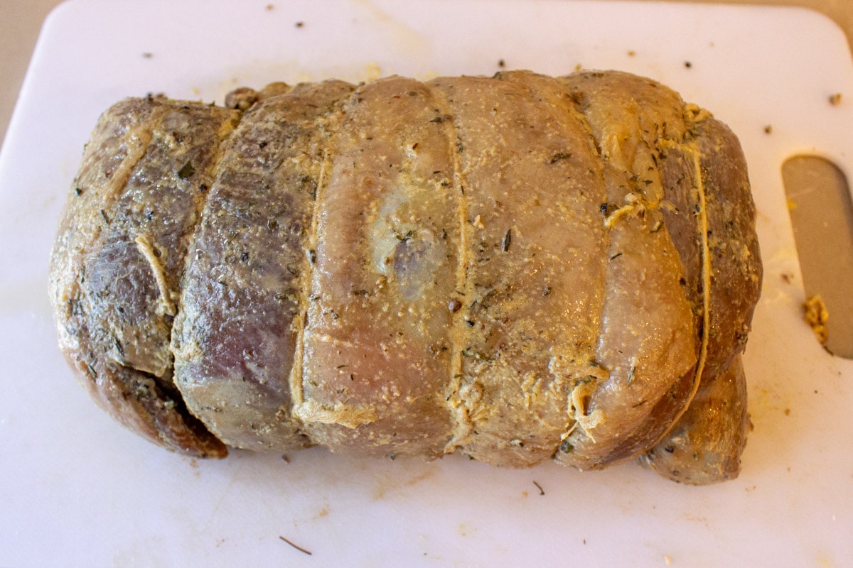 seasoned cooked leg of lamb before searing.