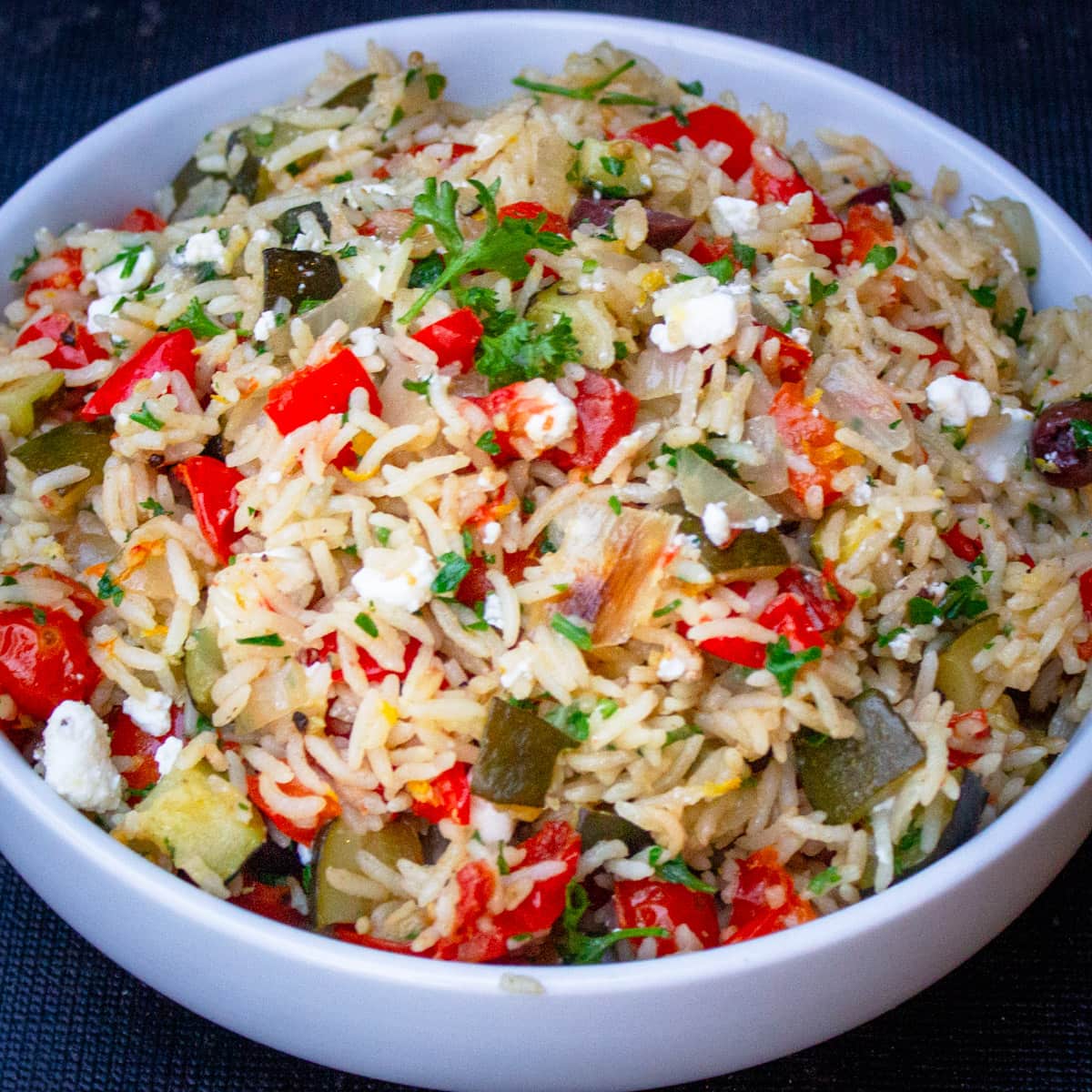 Mediterranean rice with veggies in bowl.