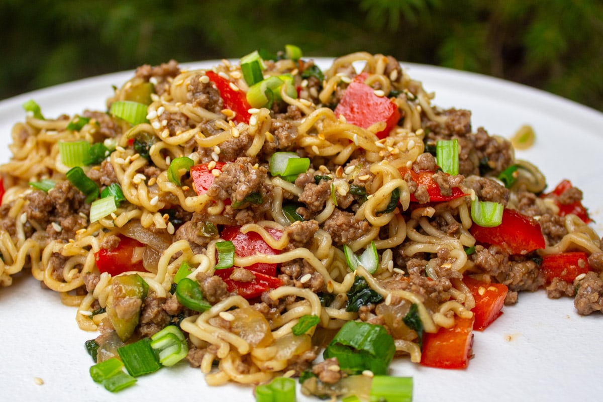 beef, noodles and mixed with vegetables on plate.