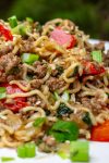 beef, noodles and mixed with vegetables on plate.
