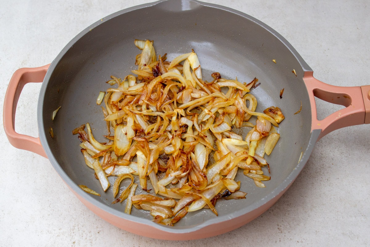 caramelized sliced onions in skillet.