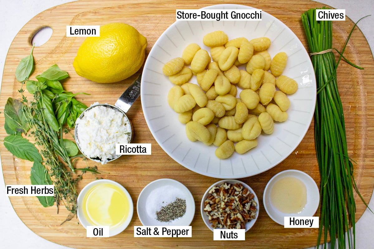 Store-bought gnocchi, ricotta, lemon, fresh herbs, chives, nuts, oil, salt, pepper, honey.