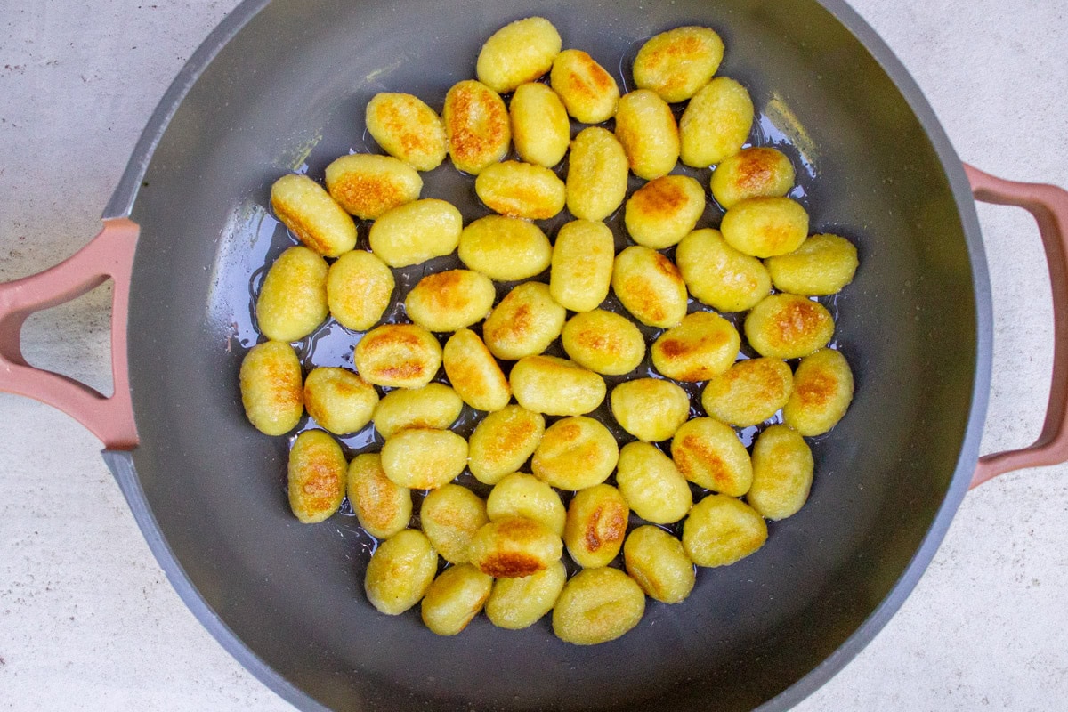 Gnocchi sauteed in skillet.