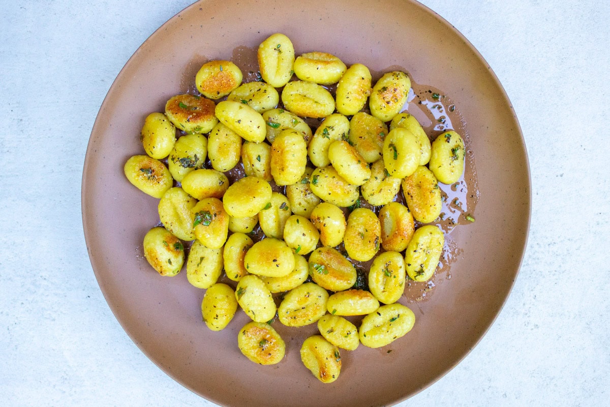 Crispy gnocchi with herb dressing.