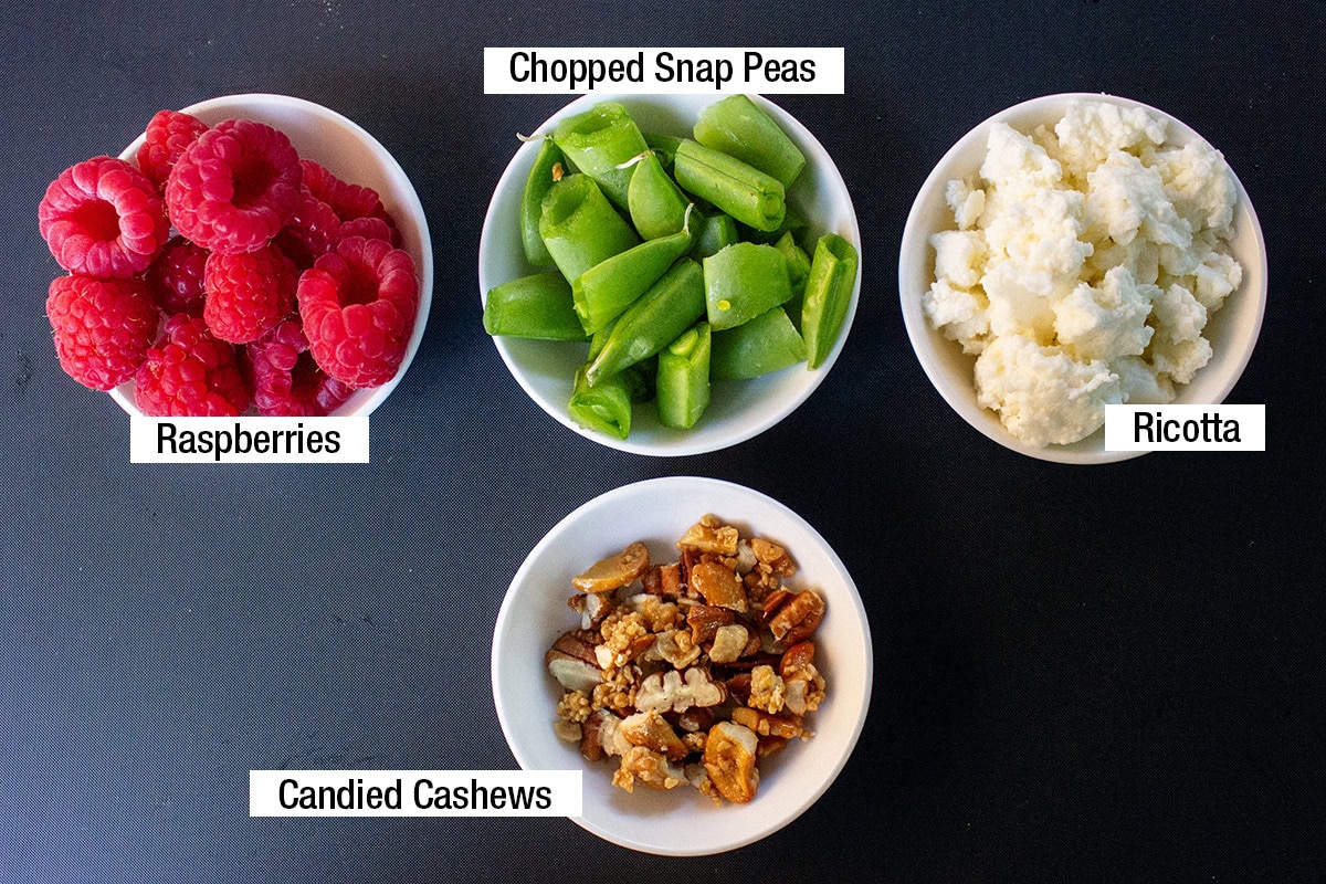 Raspberries, chopped snap peas, ricotta, candied cashews.