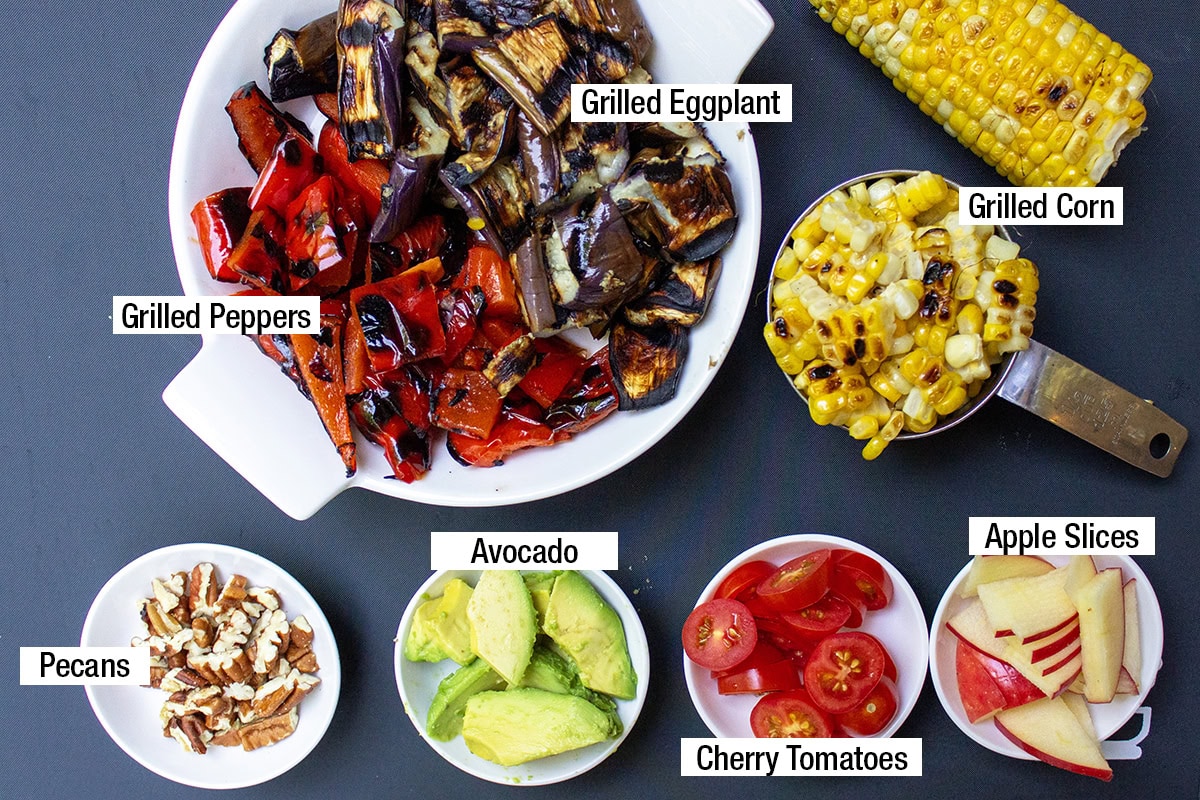 Grilled peppers, grilled eggplant, grilled corn, apple slices, avocado, pecans, cherry tomatoes.