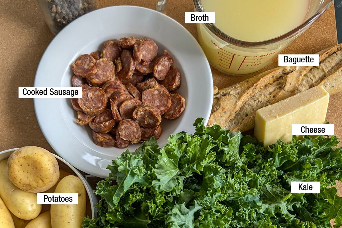 Kale, cooked sausage, broth, baguette, cheese, potatoes.