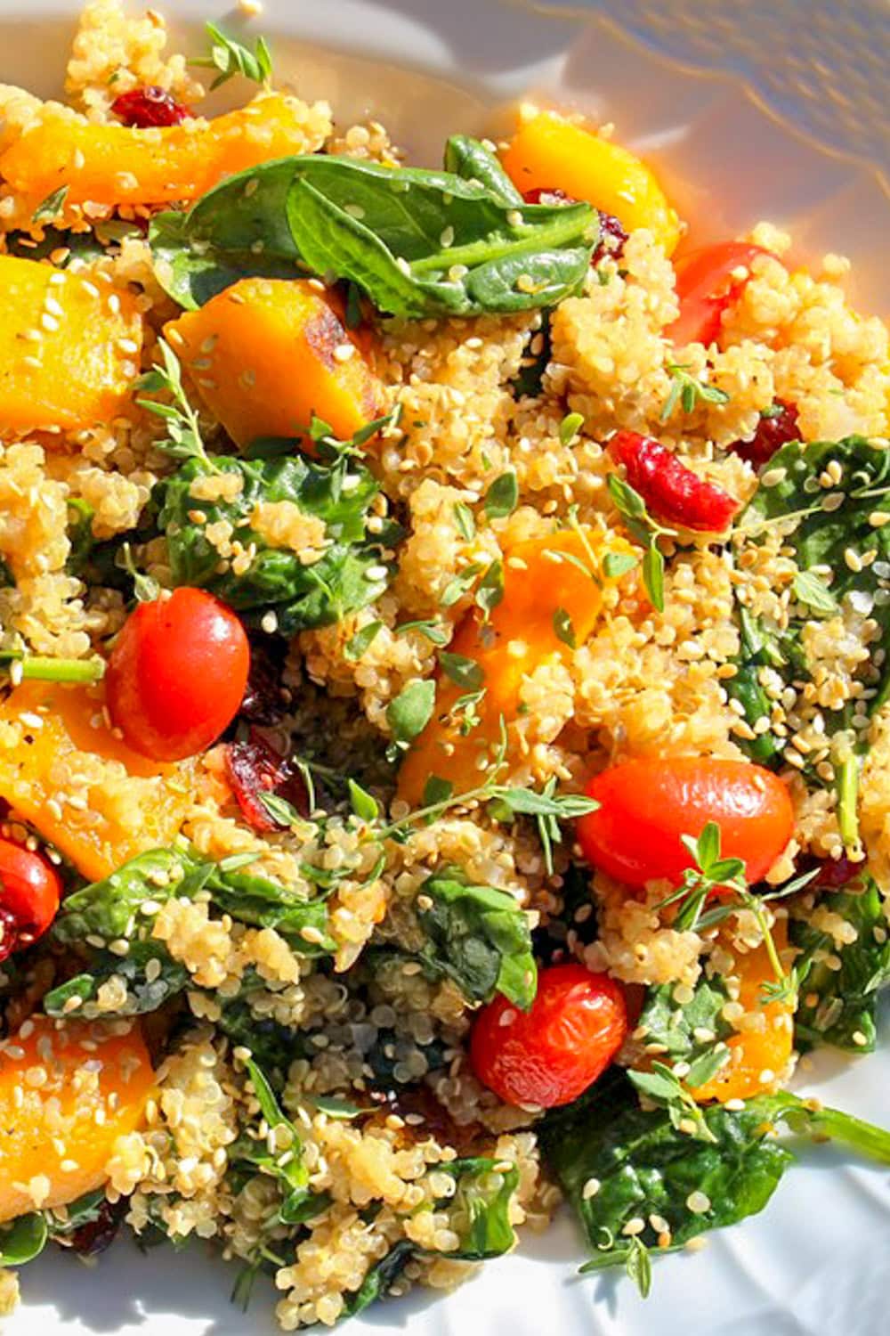 butternut squash salad with quinoa and spinach on serving platter.
