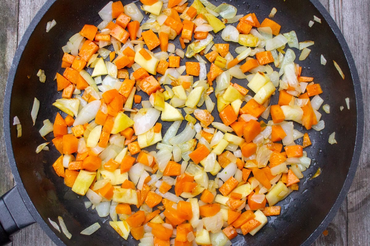 Sauteed root vegetables in skillet.