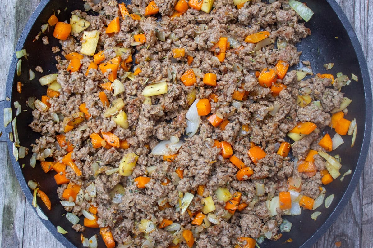 Impossible beef and veggies in skillet.