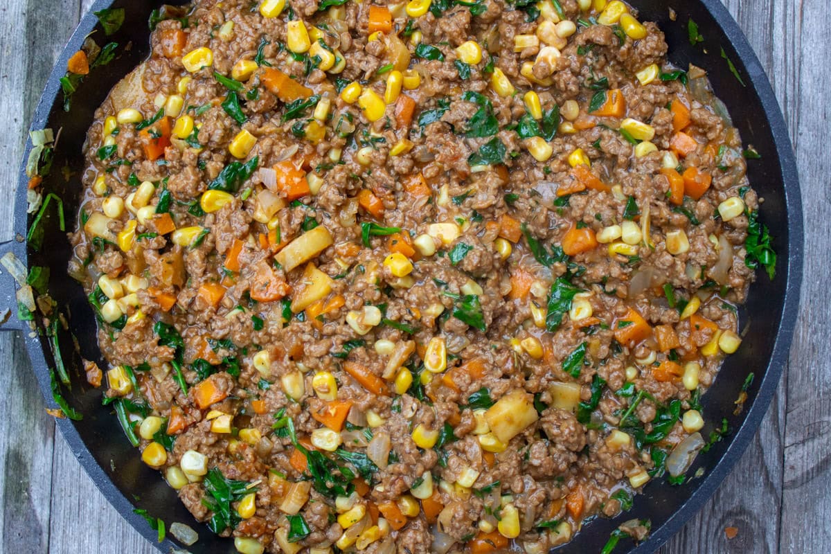 Shepherds pie filling with gravy in skillet.