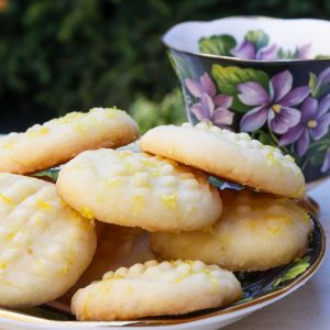 Lemon shortbread cookies on vintage saucer.