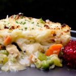 Piece of shepherd's pie with turkey on plate.