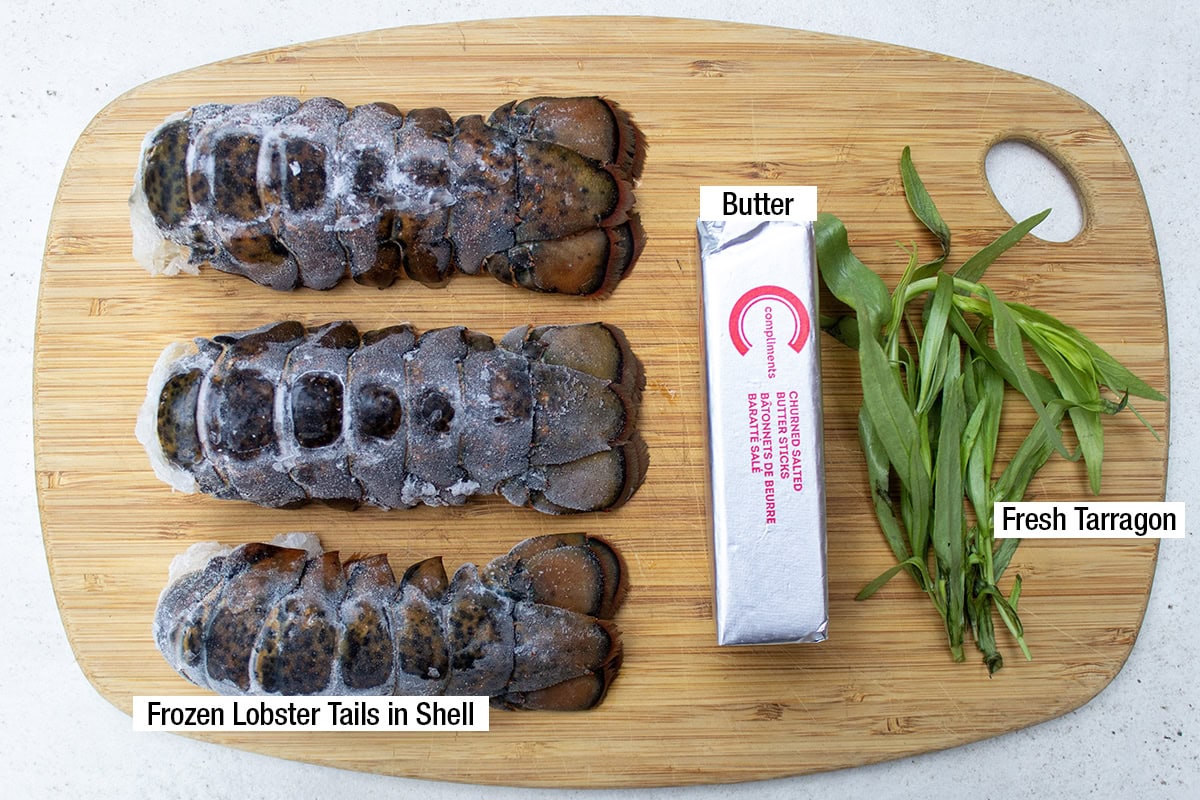 Frozen lobster tails in shell, butter, fresh tarragon.