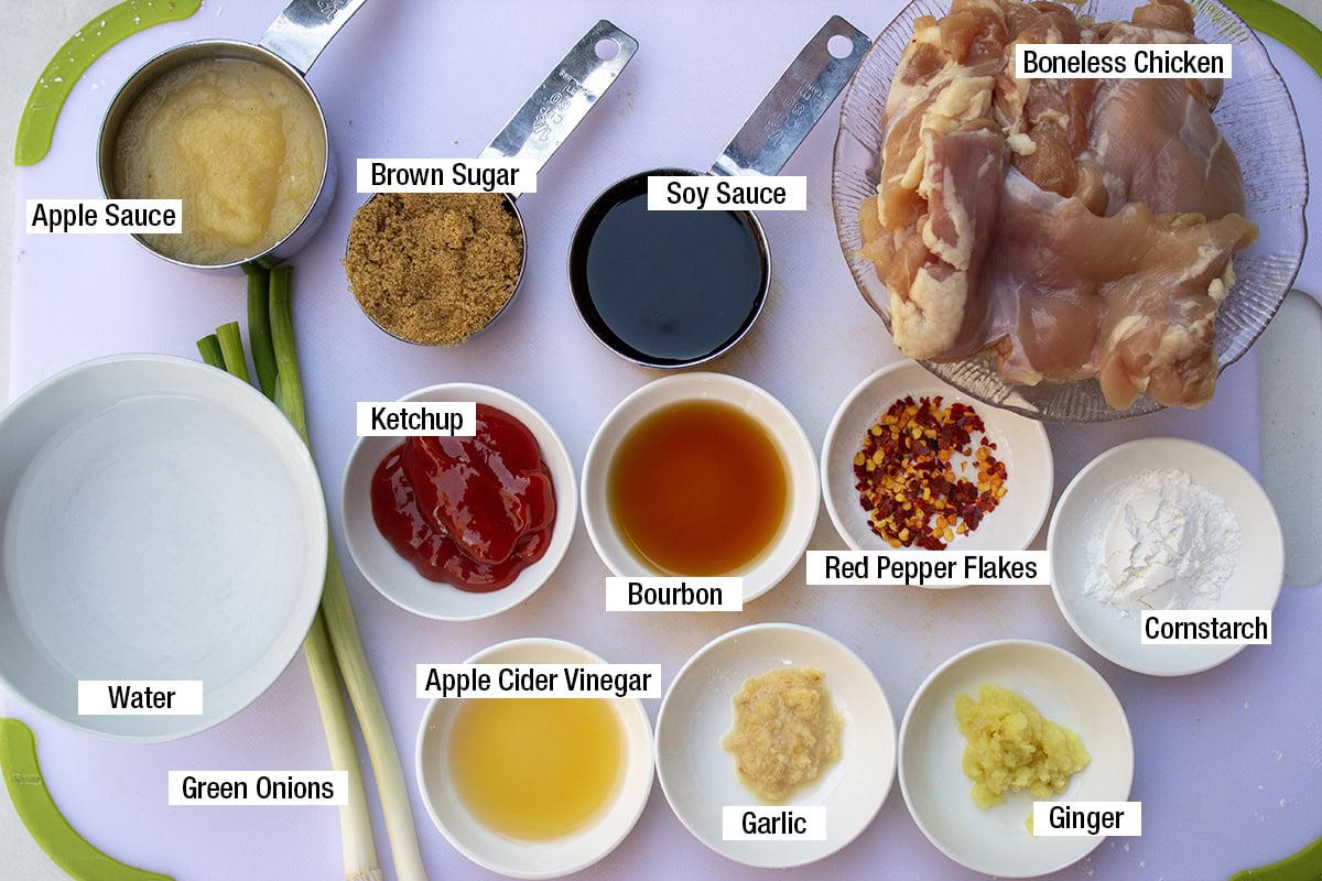 Boneless chicken, ginger, garlic, brown sugar, soy sauce, apple cider vinegar, apple sauce, red pepper flakes, ketchup, cornstarch. green onions, water, bourbon.