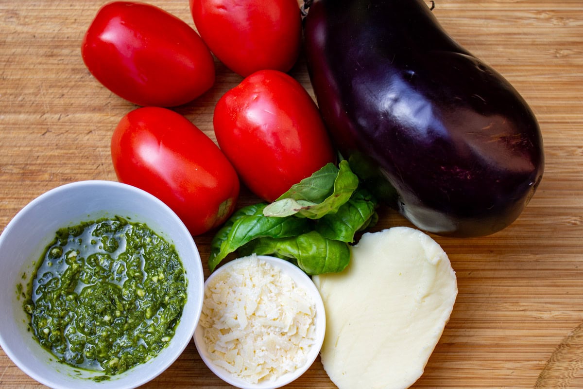 Eggplant, roma tomatoes, pesto, basil, parmesan cheese, mozzarella cheese.