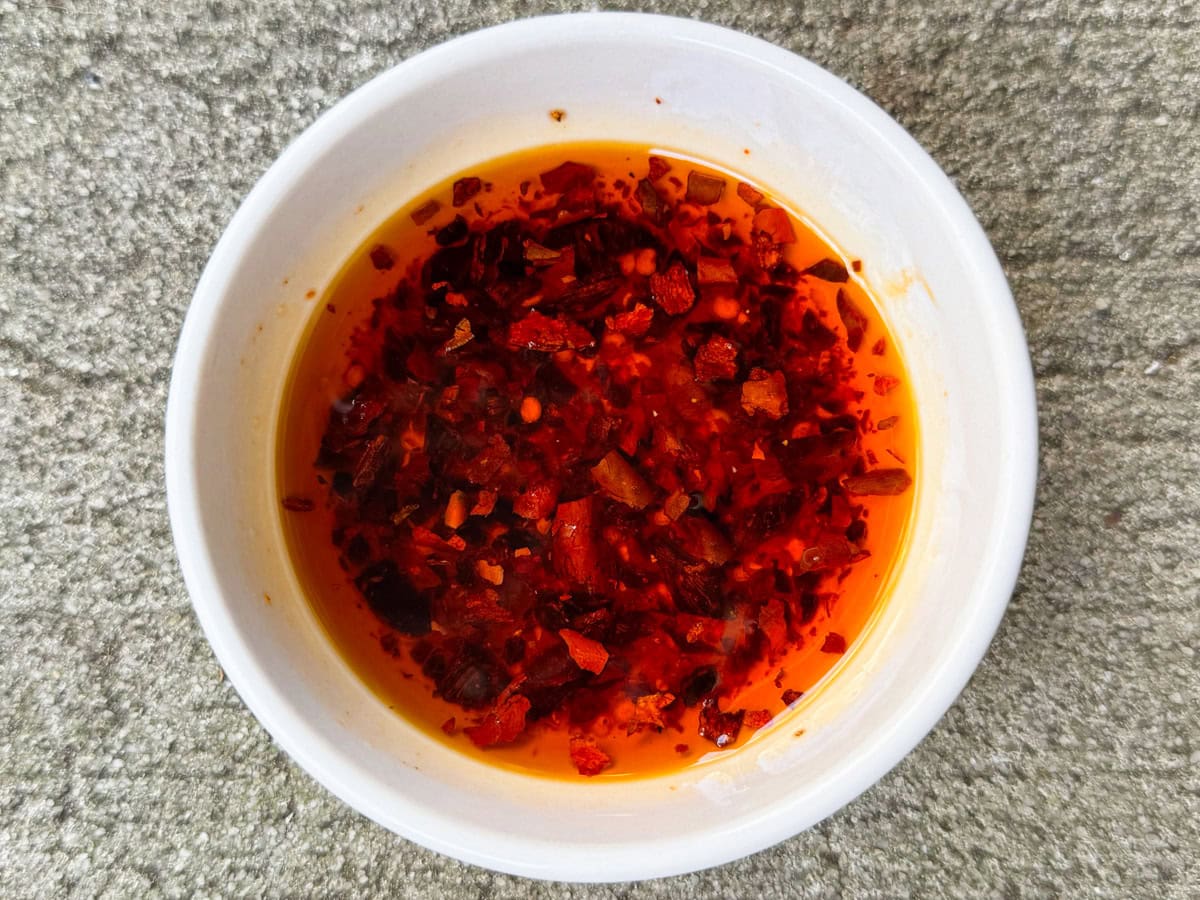 Asian dressing in a small bowl.