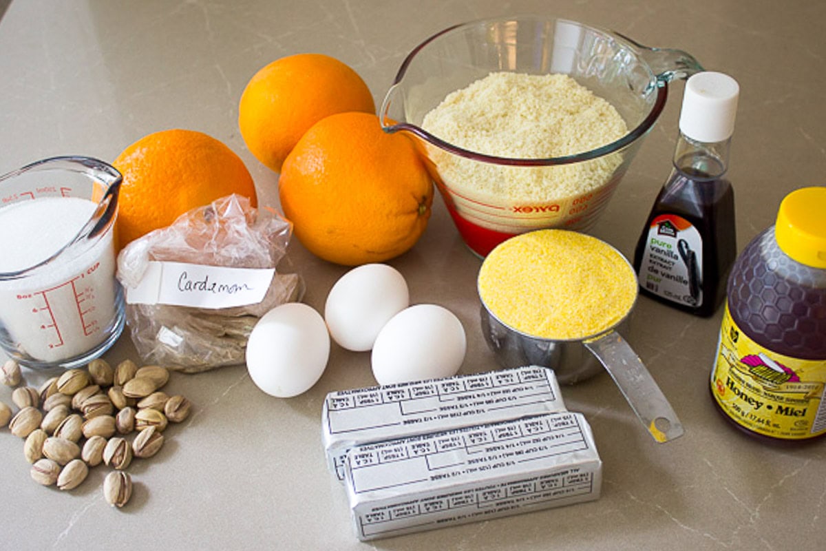 Finely ground cornmeal, vanilla, almond flour, oranges, eggs, butter, pistachios, baking powder, cardamom.