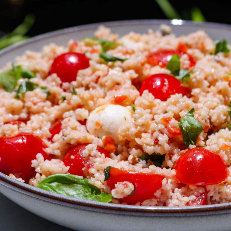 Caprese-style pastina salad in a bowl.