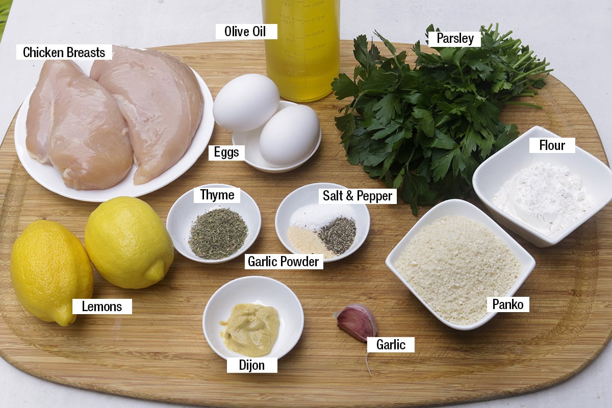 Chicken breasts, eggs, lemons, parsley, olive oil, salt, pepper, garlic powder, thyme, Dijon, garlic, panko, flour.