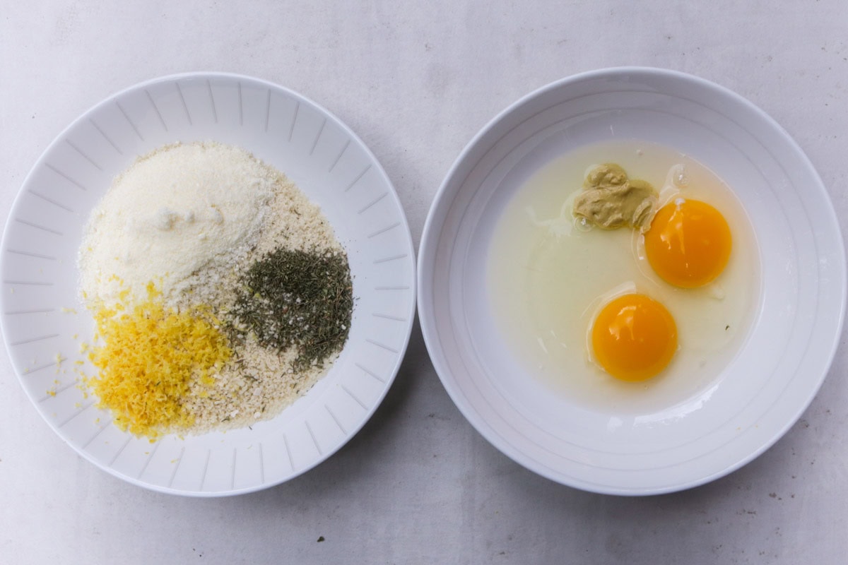 One bowl with eggs and Dijon. Second bowl with panko, parmesan, lemon zest and seasonings.