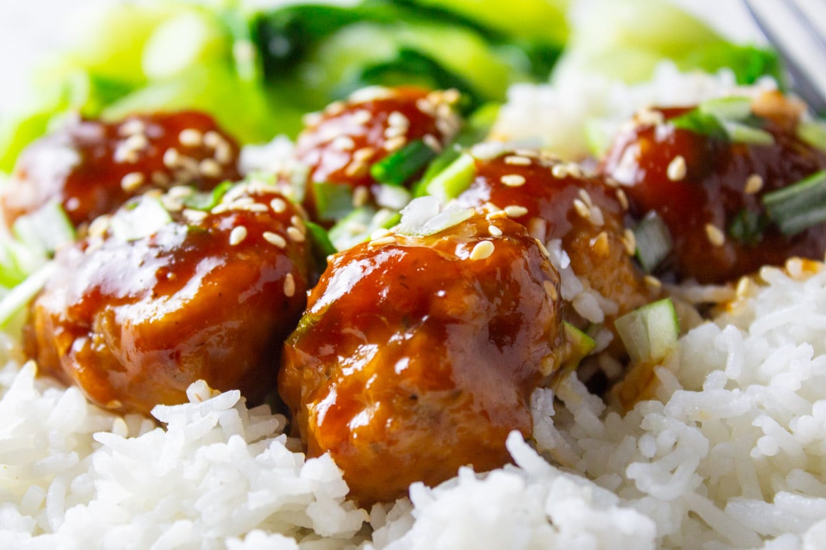 chicken meatballs with sticky sauce over white rice. 