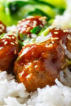 chicken meatballs with sticky sauce over white rice.