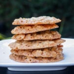 Stack of lace cookies on a plate.