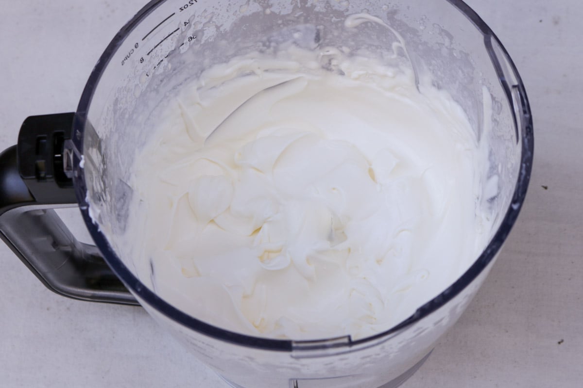 Whipped cream in a glass bowl. 