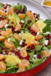 Mandarin orange salad in a shallow serving bowl on table.