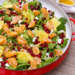 Mandarin orange salad in a shallow serving bowl on table.